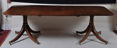 Lot 1393 - A mahogany twin pedestal dining table, the...