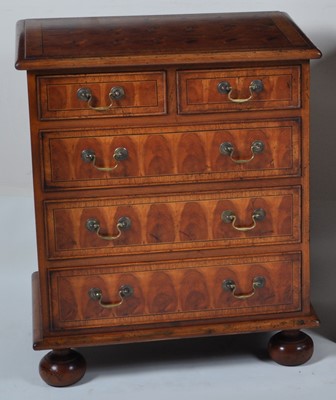 Lot 1360 - A walnut and yew wood oyster veneered chest,...