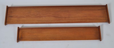 Lot 427 - Two 1960s teak floating wall shelves, each...