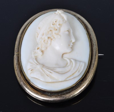 Lot 1153 - A 19th century ivory portrait miniature carved...