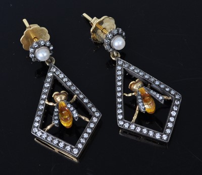 Lot 1142 - A pair of Art Deco style yellow metal,...