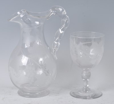 Lot 1033 - A Victorian glass wine jug, of baluster form...