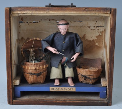 Lot 1230 - A Chinese softwood cased diorama of a cobbler...