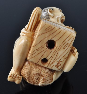 Lot 1243 - A Japanese Meiji period carved ivory netsuke...