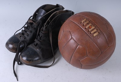 Lot 712 - A 1950's brown stitched leather football with...