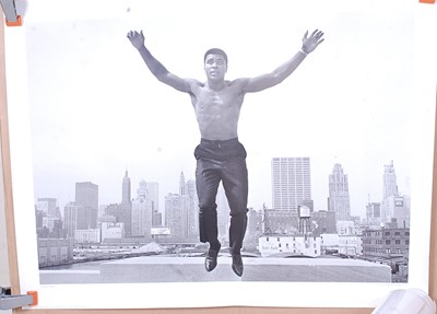 Lot 728 - Muhammad Ali, a black and white montage print...