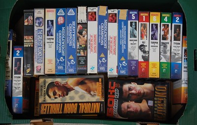 Lot 732 - Four boxes of boxing related VHS cassettes,...