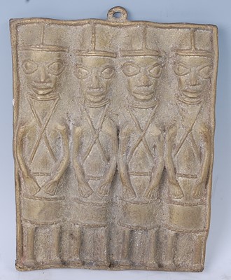 Lot 144 - A cast brass plaque depicting four figures...