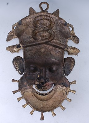Lot 146 - A large cast brass wall mask, in the form of a...