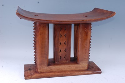 Lot 150 - A large carved hardwood "Kings" type stool,...