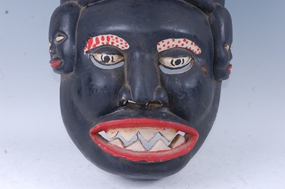 Lot 152 - A large African ritual mask, having two horns...