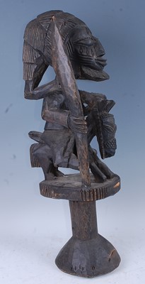Lot 153 - A large carved Shango form figure of a hunter...