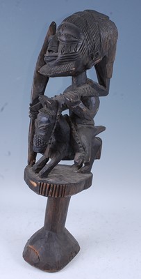 Lot 153 - A large carved Shango form figure of a hunter...