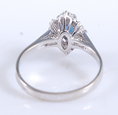 Lot 2539 - A white metal, sapphire and diamond navette...