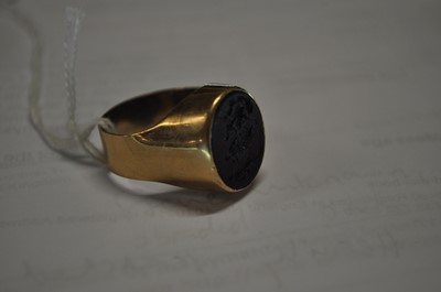Lot 2541 - A yellow metal signet ring, having an oval...