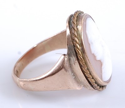 Lot 2545 - A 9ct yellow gold oval carved shell cameo ring,...