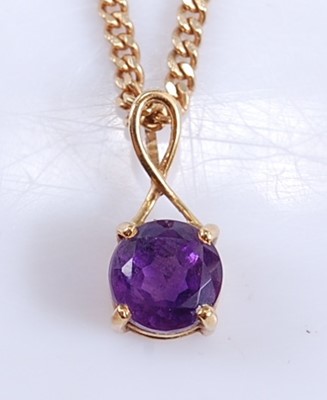 Lot 2556 - An 18ct yellow gold amethyst pendant and chain,...