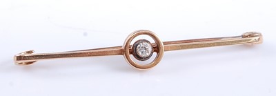 Lot 2562 - A yellow metal diamond bar brooch, featuring a...