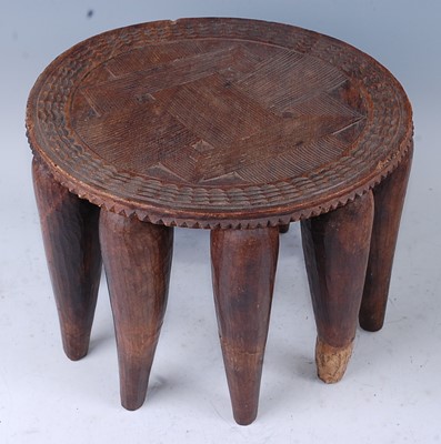 Lot 158 - An African hardwood stool, the circular...
