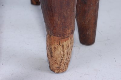 Lot 158 - An African hardwood stool, the circular...