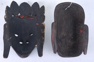Lot 290 - A carved wooden mask with polychrome painted...