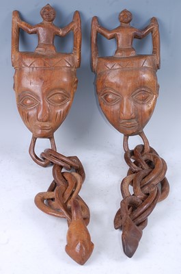 Lot 172 - A pair of marriage ritual masks, each carved...