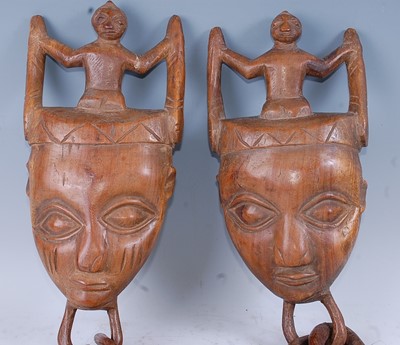 Lot 172 - A pair of marriage ritual masks, each carved...