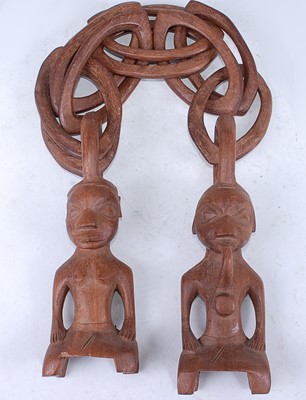 Lot 173 - A pair of carved wooden Eden figures, each in...