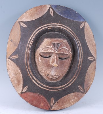 Lot 182 - A carved wooden "Sun" society mask of oval...