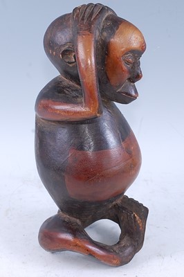 Lot 184 - An unusual fertility figure, carved as a male...