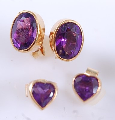 Lot 2564 - Two pairs of yellow metal amethyst stud...