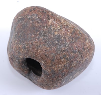 Lot 365 - A stone mace head, of near globular form with...