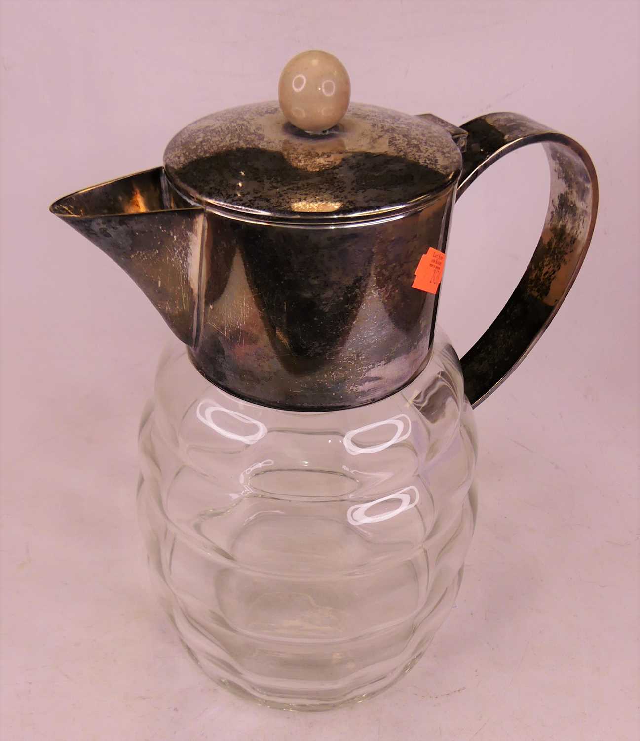 Lot 4 - A silver plated and glass water pitcher, h.29cm