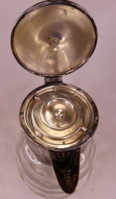 Lot 4 - A silver plated and glass water pitcher, h.29cm