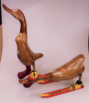 Lot 17 - A carved bamboo model of a duck wearing red...