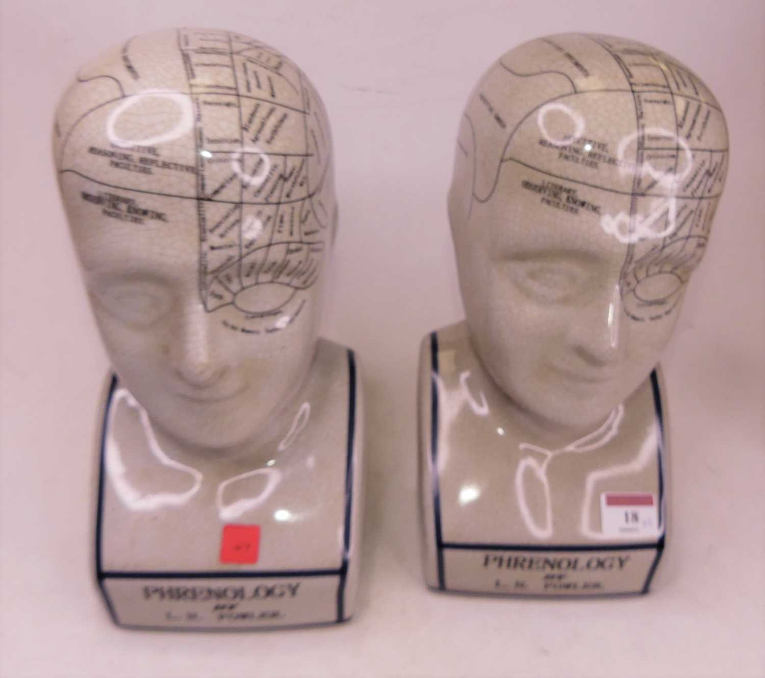 Lot 18 - A pair of reproduction pottery phrenology...