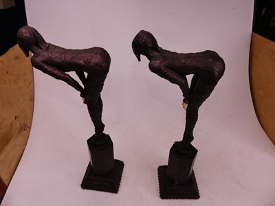 Lot 31 - A pair of Art Deco style resin figures of...