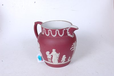 Lot 33 - A Wedgwood crimson Jasperware jug, circa 1870,...