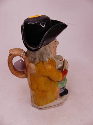 Lot 36 - A Staffordshire style pottery Toby jug, in the...