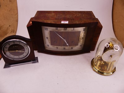 Lot 39 - A 1930s Art Deco walnut cased mantel clock,...