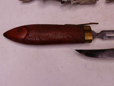 Lot 49 - A 20th century Eastern carved knife and fork...