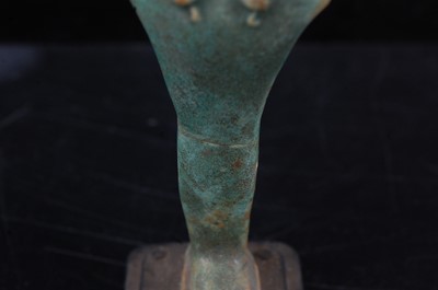 Lot 370 - An Egyptian green glazed faience shabti, the...