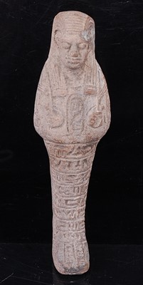 Lot 372 - An Egyptian terracotta shabti, modelled in...