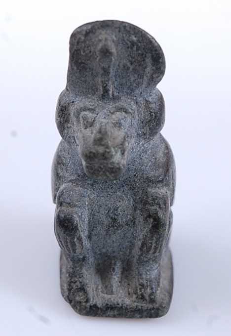 Lot 376 - An Egyptian worked basalt amulet form bead,...