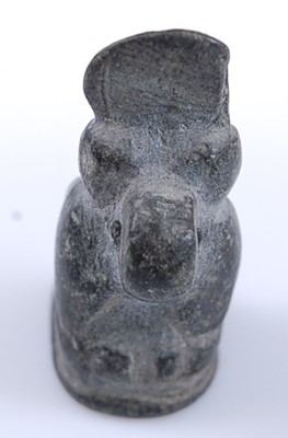 Lot 376 - An Egyptian worked basalt amulet form bead,...