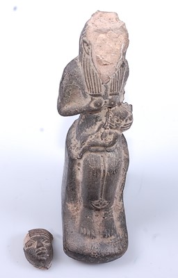 Lot 379 - An Egyptian moulded terracotta figure of the...