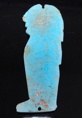 Lot 380 - An Egyptian plaque form blue faience amulet,...
