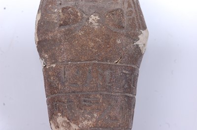 Lot 383 - An Egyptian limestone shabti fragment, carved...