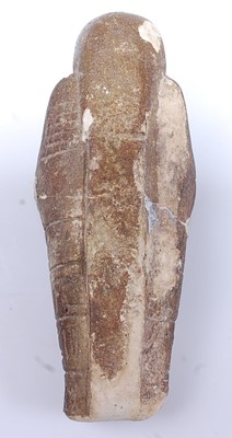 Lot 383 - An Egyptian limestone shabti fragment, carved...