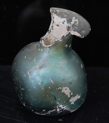 Lot 386 - An Egyptian / Roman green glass scent bottle,...